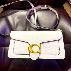 Am selling am coach purse that I used once.